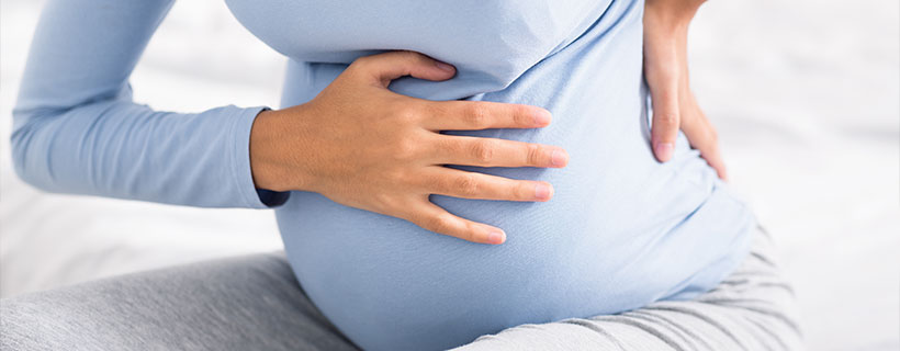 Patient suffering from Pregnancy Pain in need of chiropractor in ' . $businessCity . '